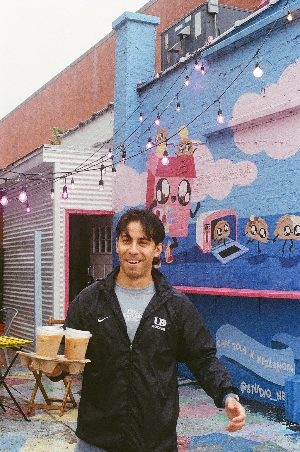 Person standing outside a colorful Chicago storefront