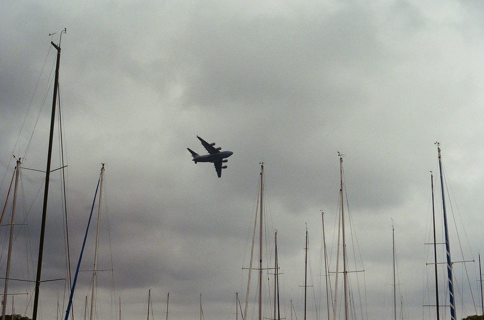 Airplane flying over a Chicago marina