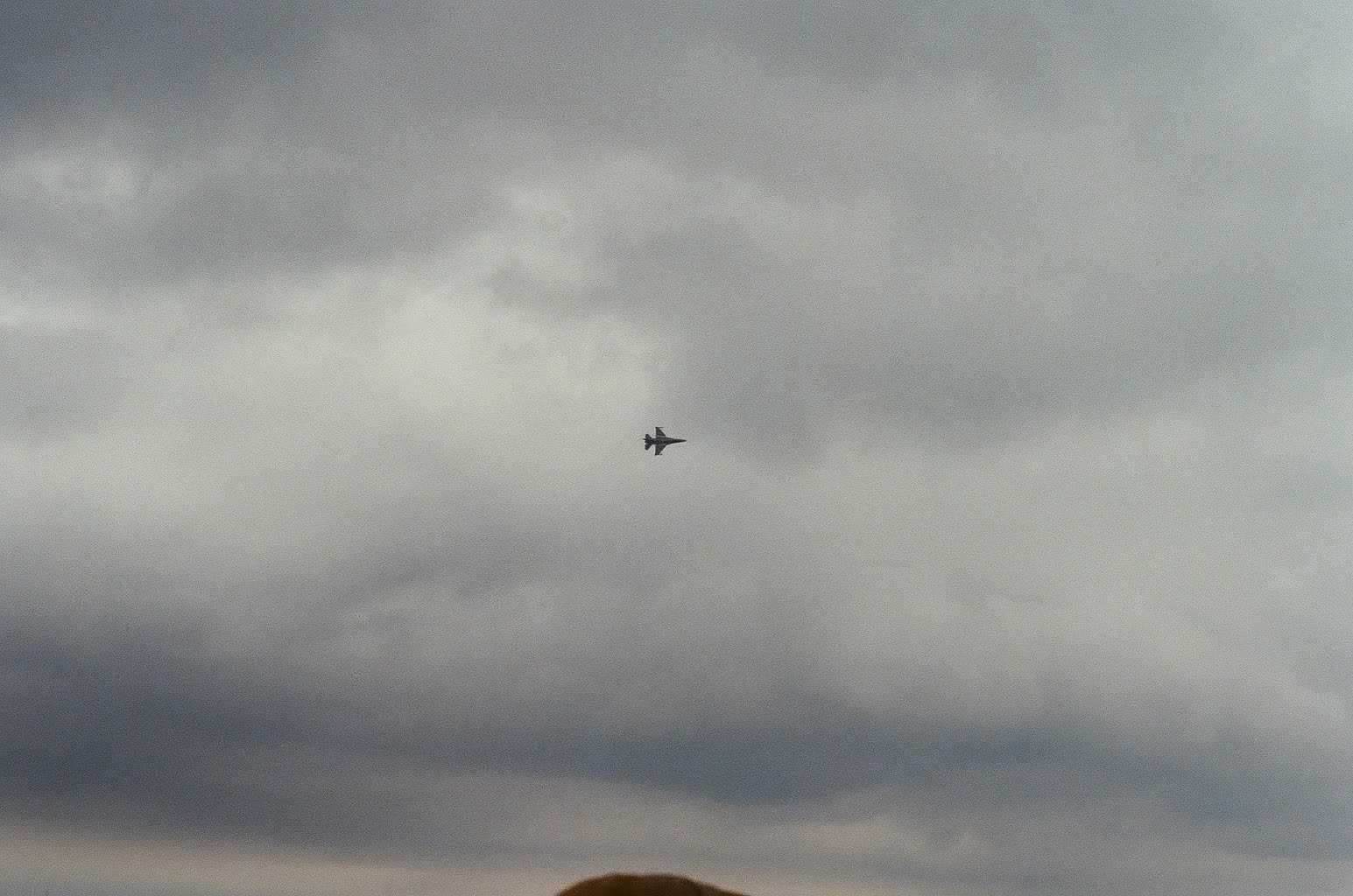 Airplane in a cloudy Chicago sky