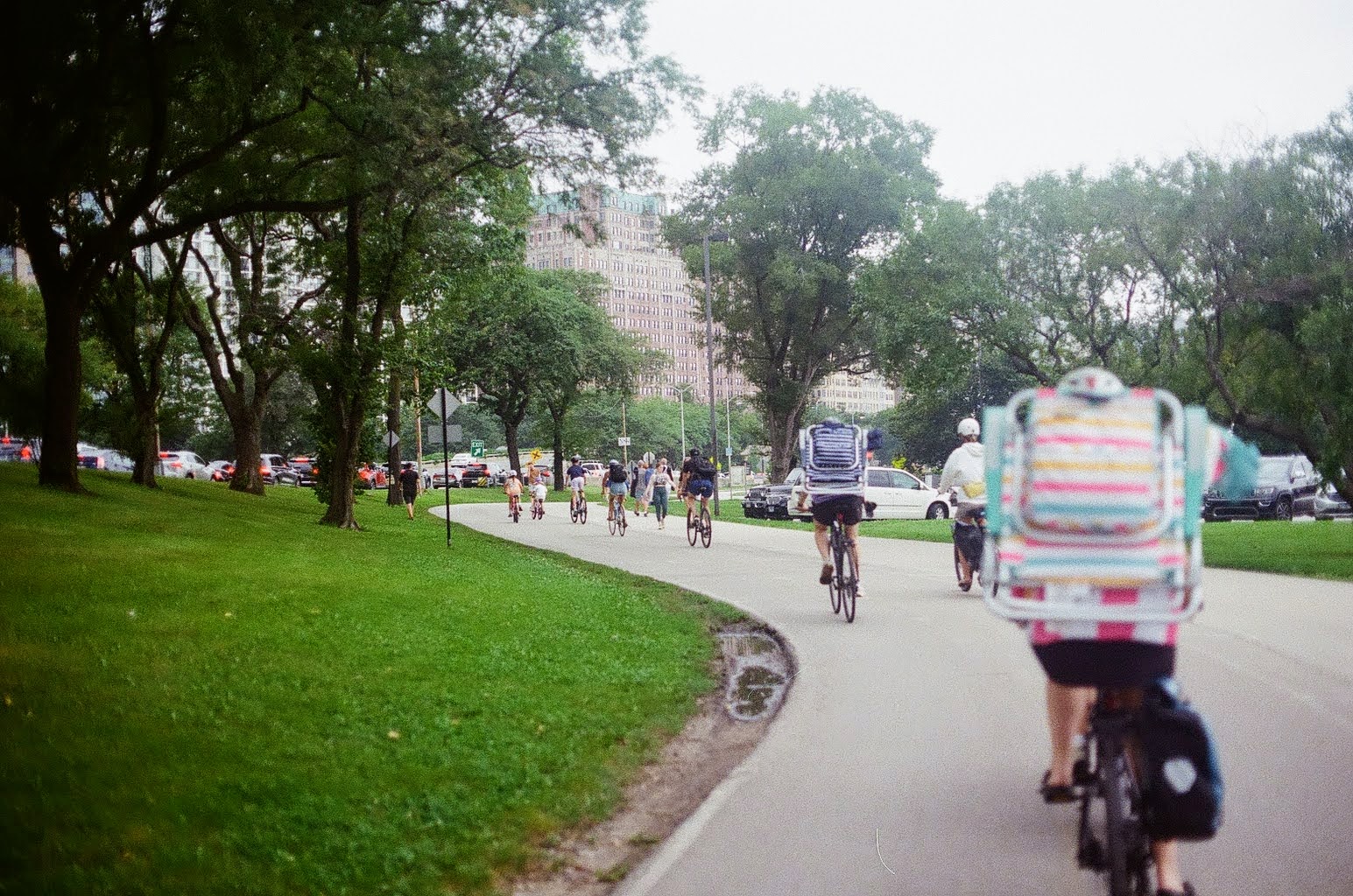 Cyclists riding through a Chicago park