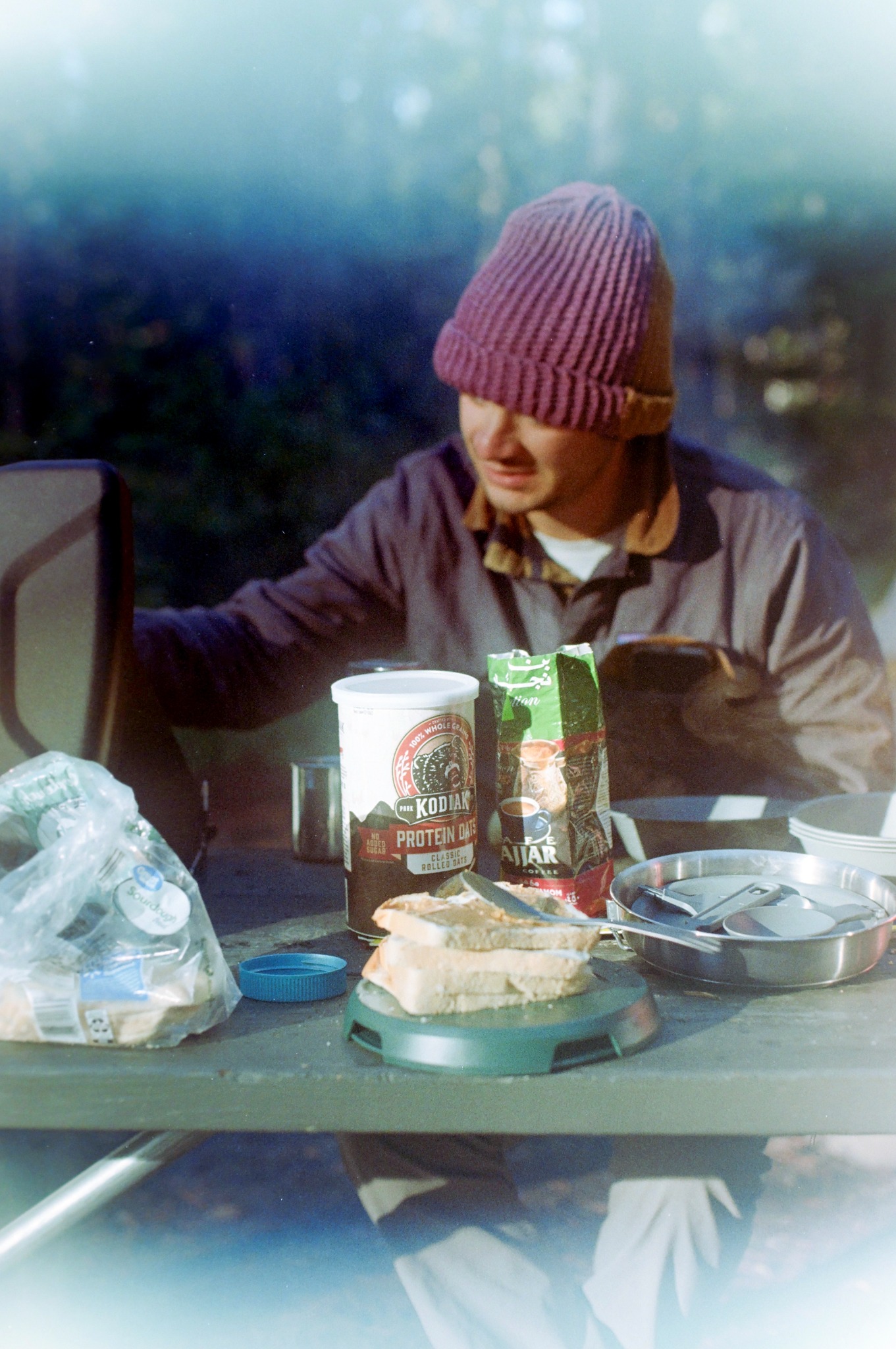 Person sitting at a campsite table